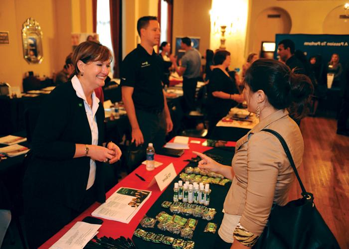 People conversing at a job fair